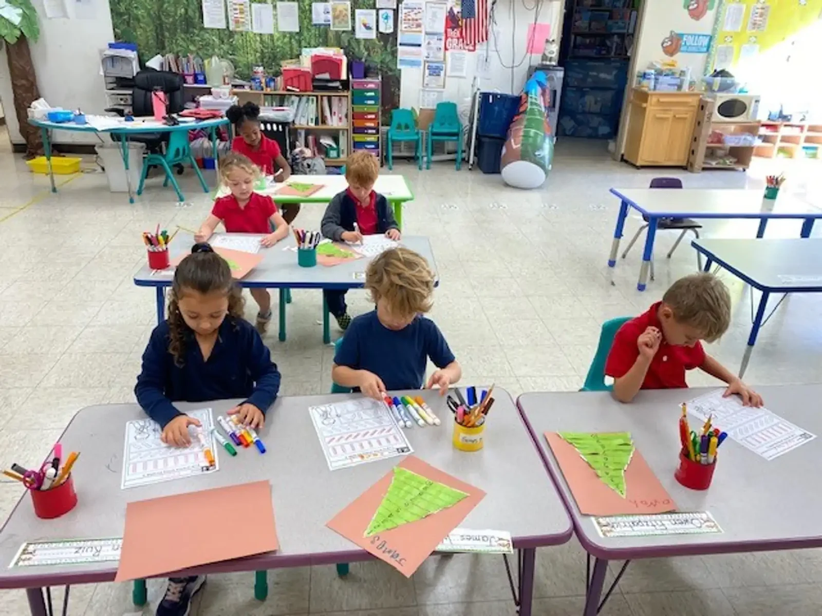Transitional kindergarten and kindergarten students working at their tables at Reformation Lutheran School