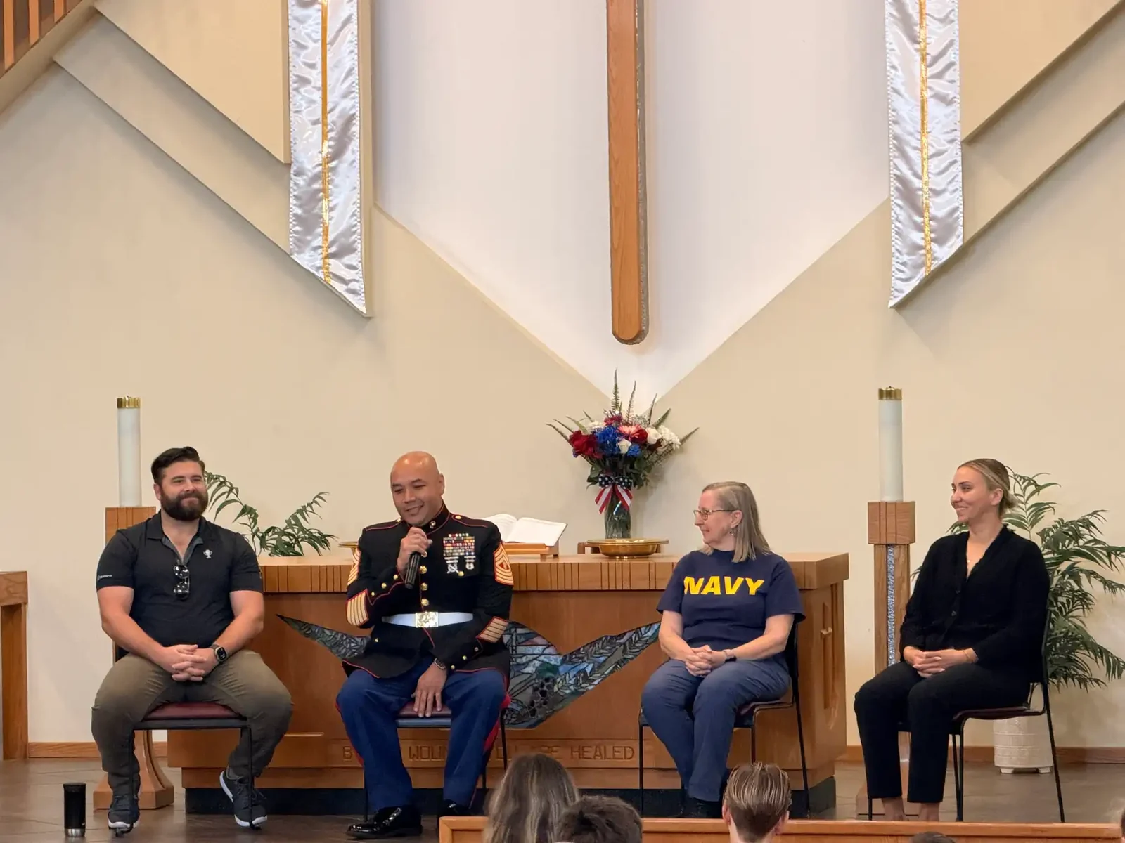 Veterans from Reformation families answering students' questions during the Veterans Day program in the church